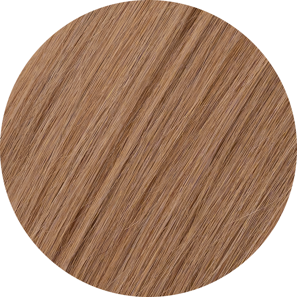 A close-up image of honey blonde clip-in hair extensions showcasing the texture and color of the hair.