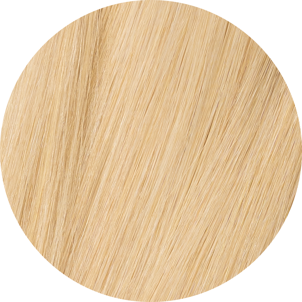 A close-up image of light blonde clip-in hair extensions showcasing the texture and color of the hair.